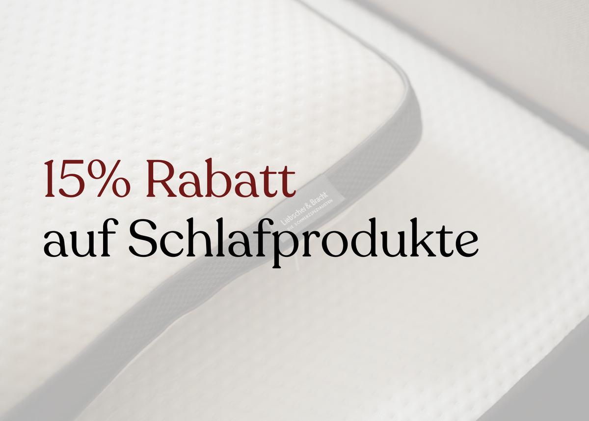 Eine weiße Matratze mit schwarzem Rand; darüber steht in deutscher Sprache "15% Rabatt auf Schlafprodukte".