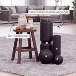 Das Dein Kiefer-Paket von Liebscher & Bracht, bestehend aus schwarzen Massagekugeln und Faszienrollen sowie einem Holzhocker, auf dem ein Stoffbeutel und kleine Holzwerkzeuge liegen.