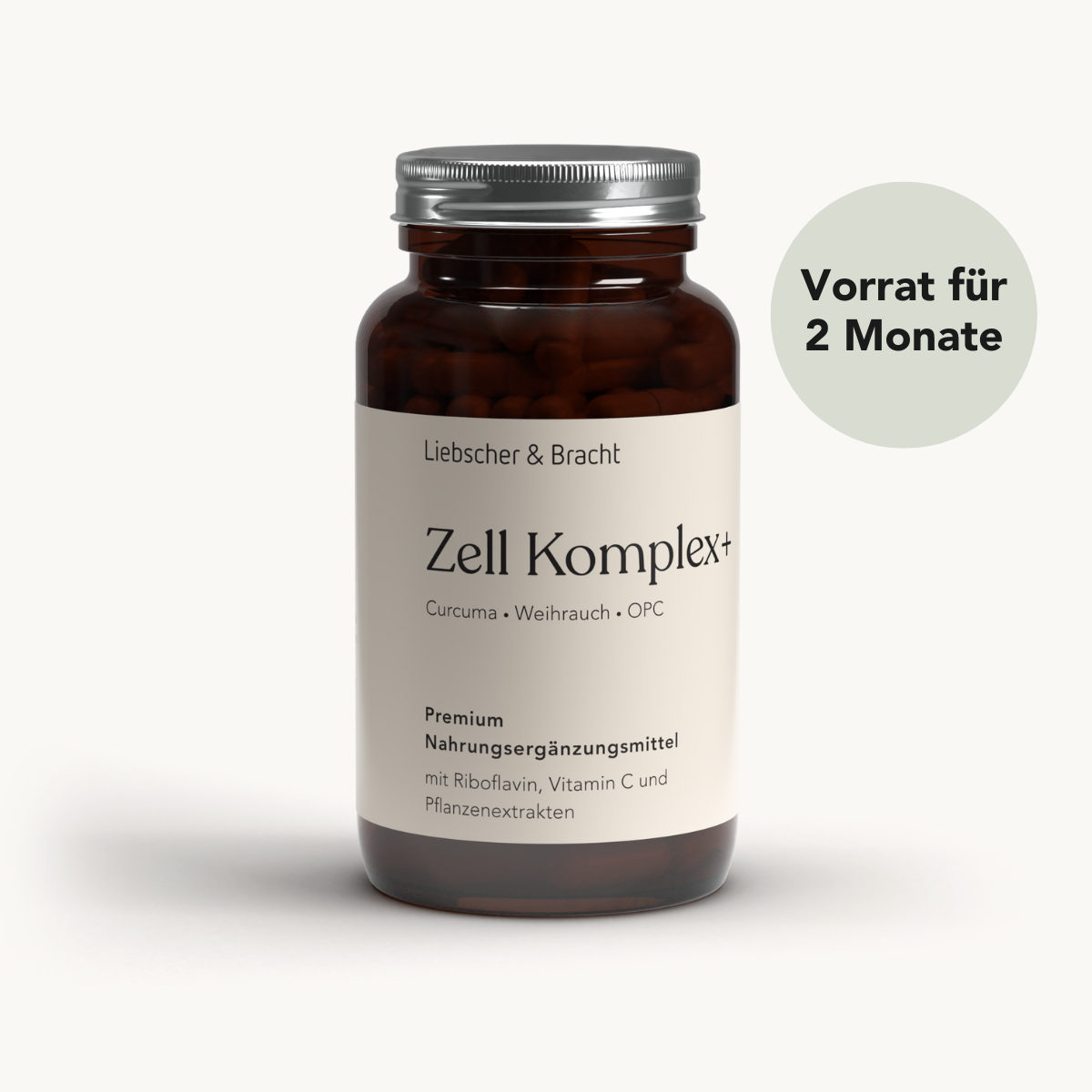 Eine braune Glasflasche mit der Aufschrift Liebscher & Bracht Zell Komplex+ für 2 Monate, mit Inhaltsstoffen wie Riboflavin, die unten aufgeführt sind, und einem runden Etikett mit der Aufschrift "Vorrat für 2 Monate" auf Deutsch. Der Hintergrund ist hell und schlicht.